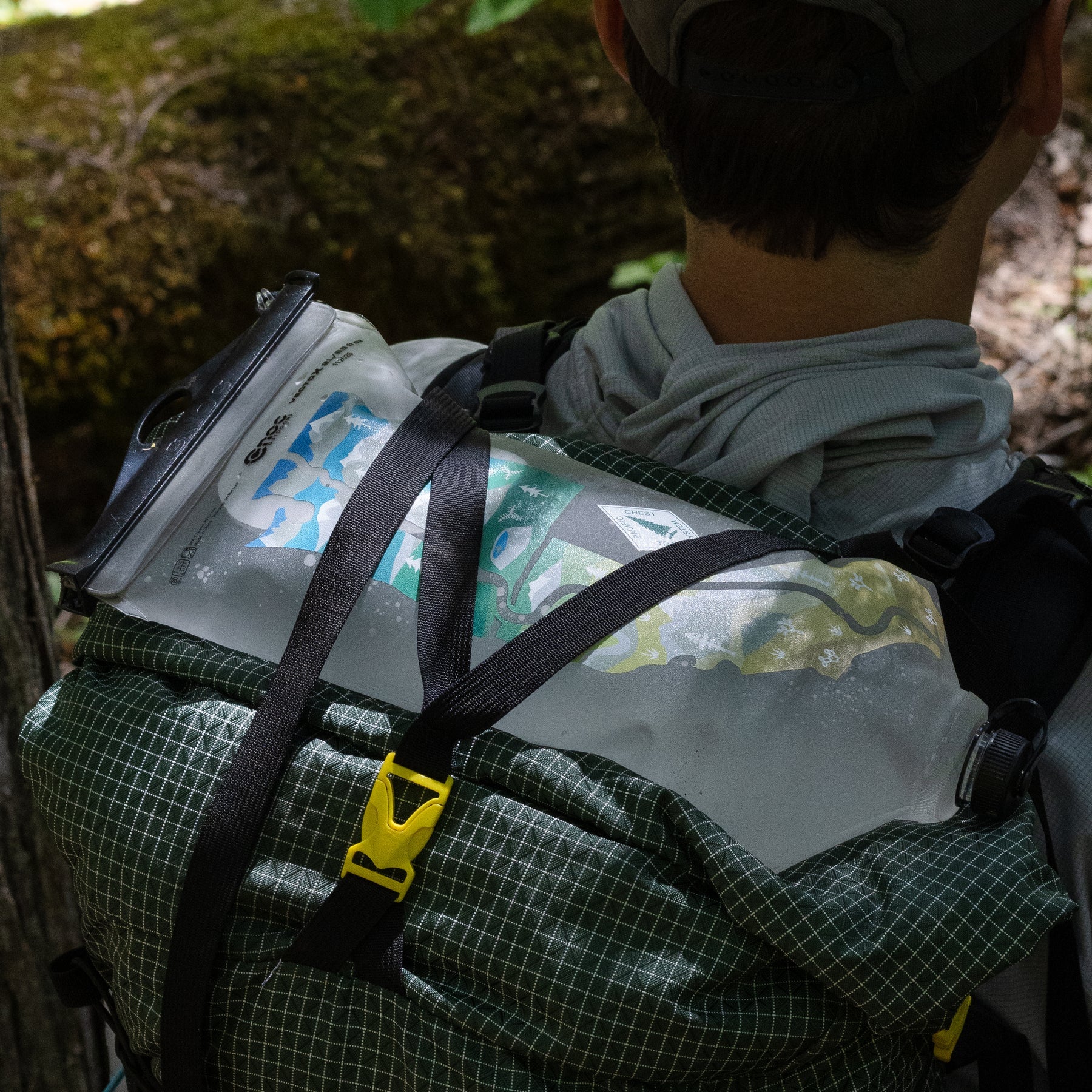 CNOC VectoX with PCT Map strapped to the top of a backpack