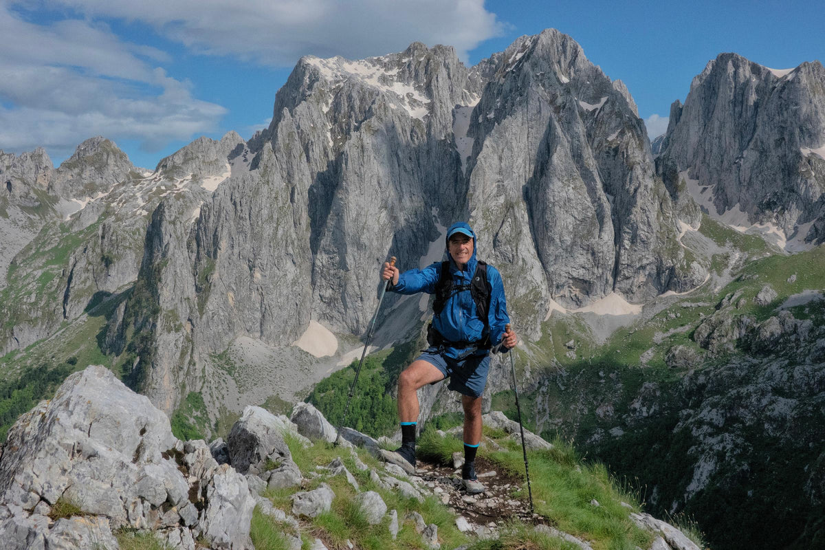 Hiker wearing the Flight Vest Harness below limestone peaks in Prokletije National Park, Montenegro