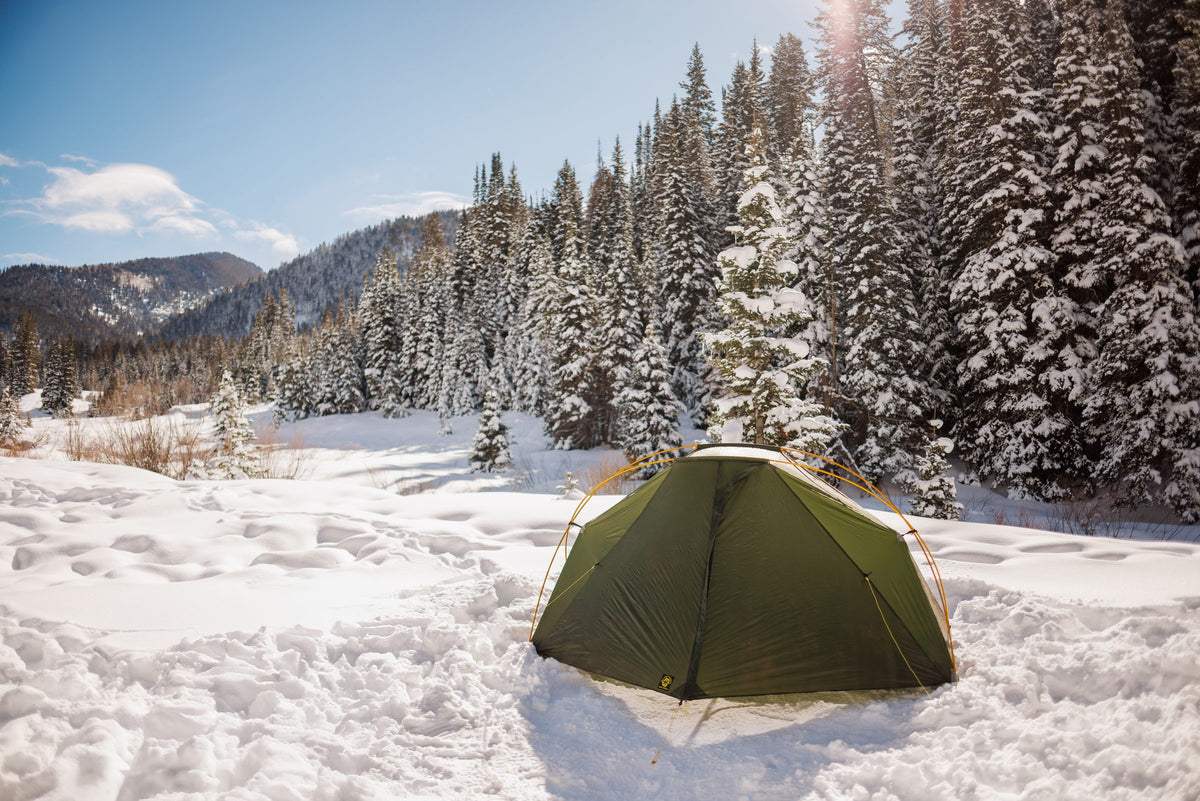 Lunar Orbiter tent pitched on snow among snow-covered pines in Utah