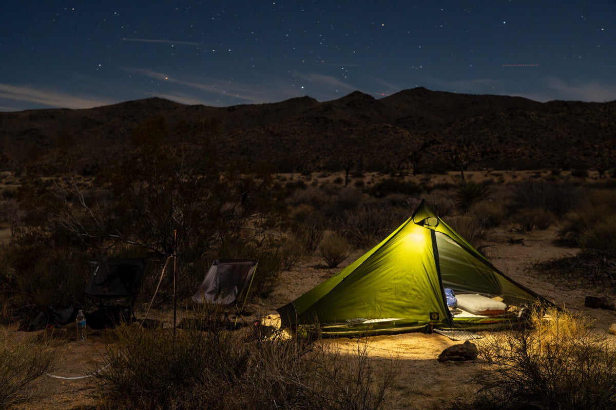 Green Lunar Solo glowing at night under the stars in the desert
