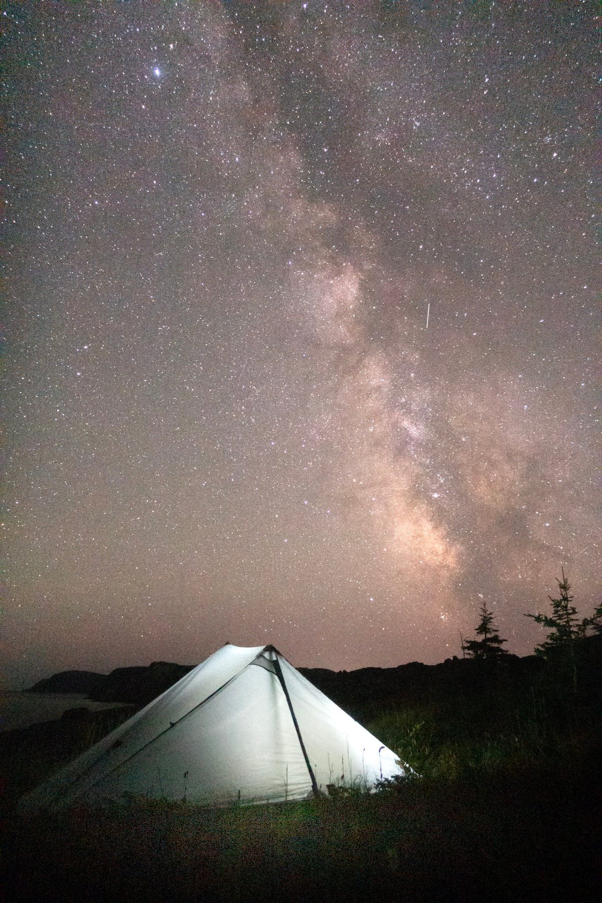 Owyhee tarp lit from inside under the Milky Way